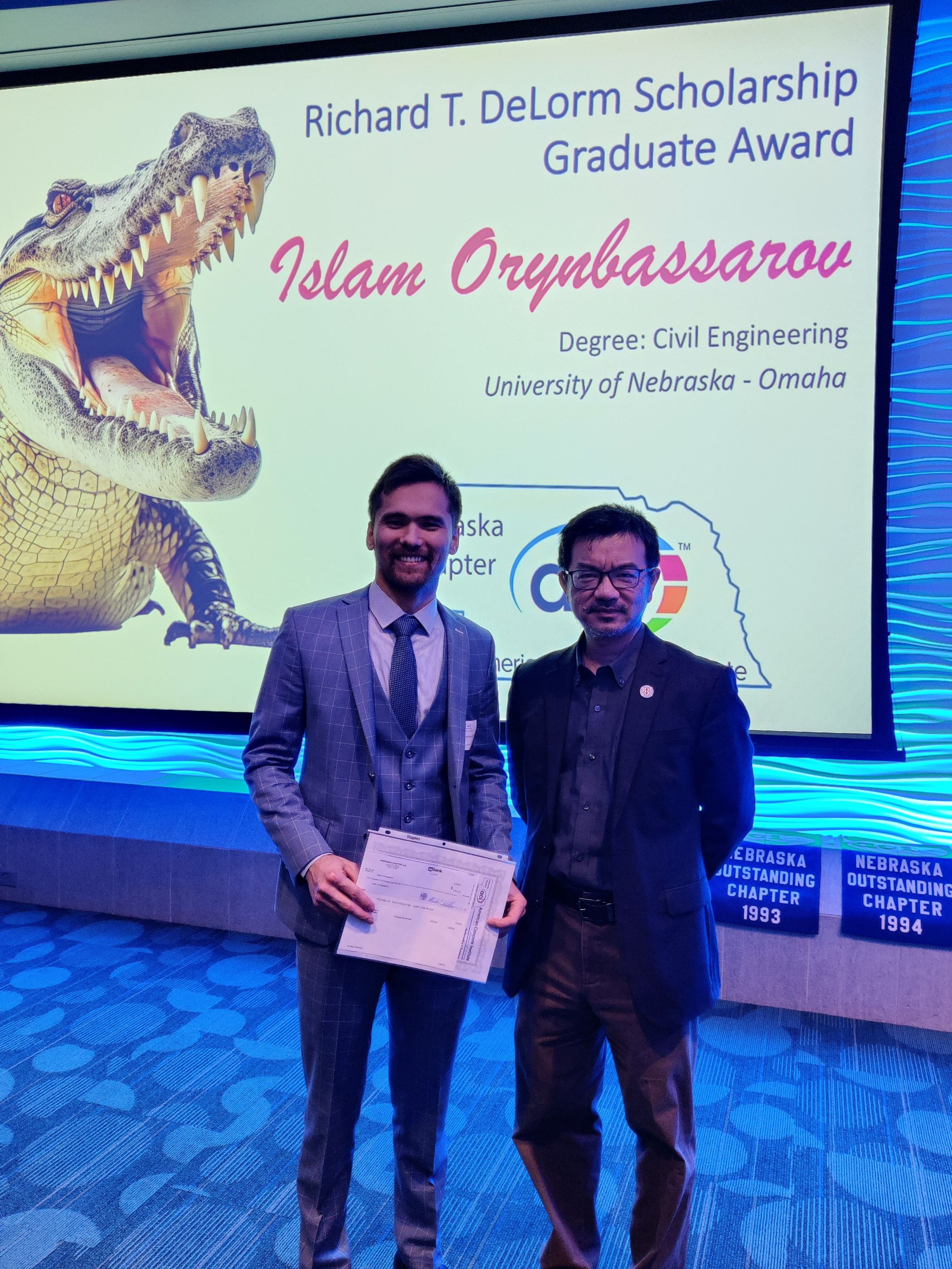 Student Islam Orynbassarov and Professor Jiong Hu at ACI Awards Ceremony